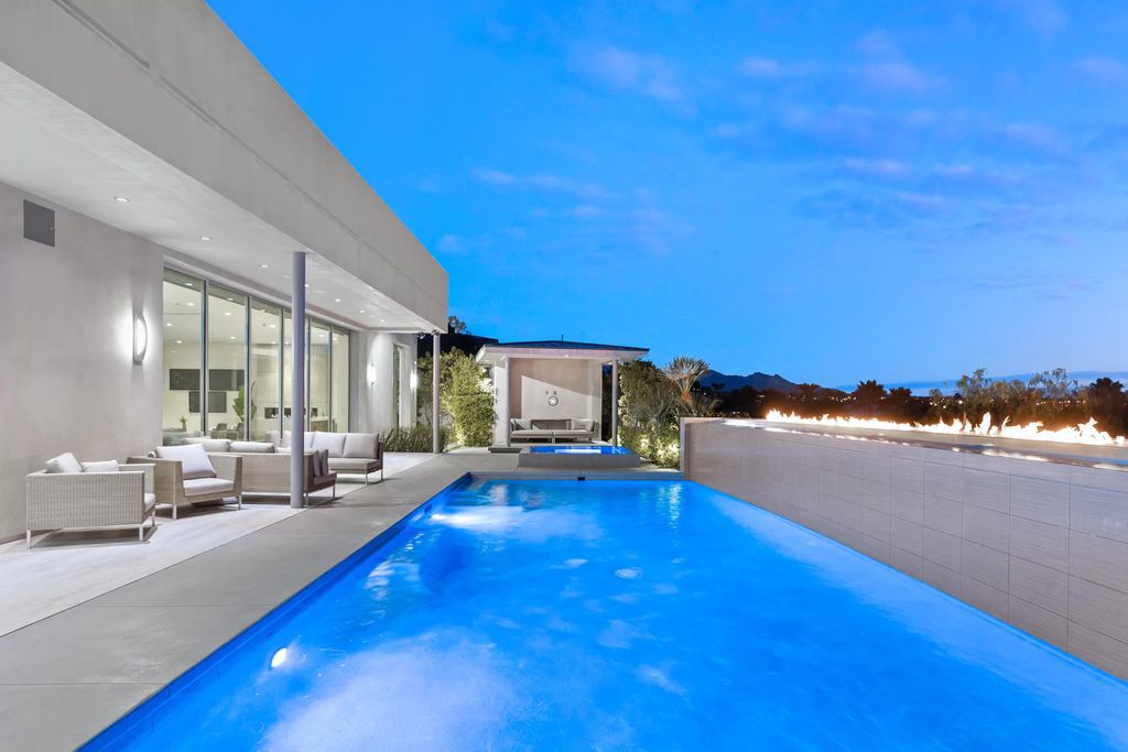 The Masterpiece in Las Vegas, a stunning contemporary home majestically perched within the prestigious guard-gated Spanish Hills offering some of the best Las Vegas Strip views. This home located at 5198 Scenic Ridge Dr, Las Vegas, Nevada.