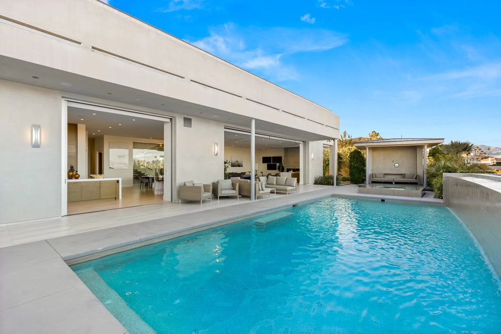The Masterpiece in Las Vegas, a stunning contemporary home majestically perched within the prestigious guard-gated Spanish Hills offering some of the best Las Vegas Strip views. This home located at 5198 Scenic Ridge Dr, Las Vegas, Nevada.