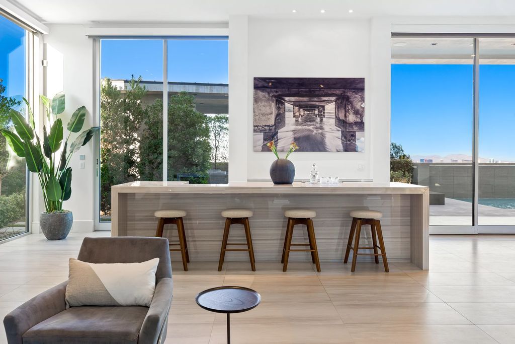 The Masterpiece in Las Vegas, a stunning contemporary home majestically perched within the prestigious guard-gated Spanish Hills offering some of the best Las Vegas Strip views. This home located at 5198 Scenic Ridge Dr, Las Vegas, Nevada.