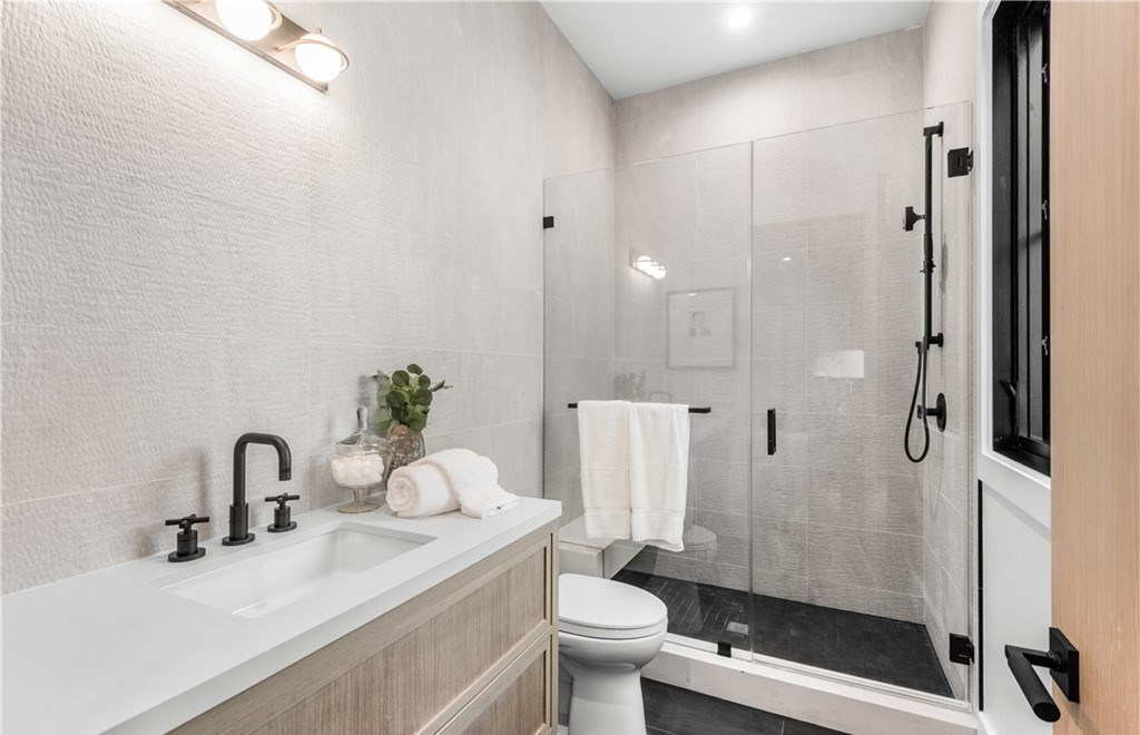 The Farmhouse in Encino, Exquisite new construction gated estate in the coveted enclave of Royal Oaks neighborhood with the sprawling grounds featuring a sparkling pool & spa, sports court, spacious elevated patio, grass area. This home located at 15825 Woodvale Rd, Encino, California