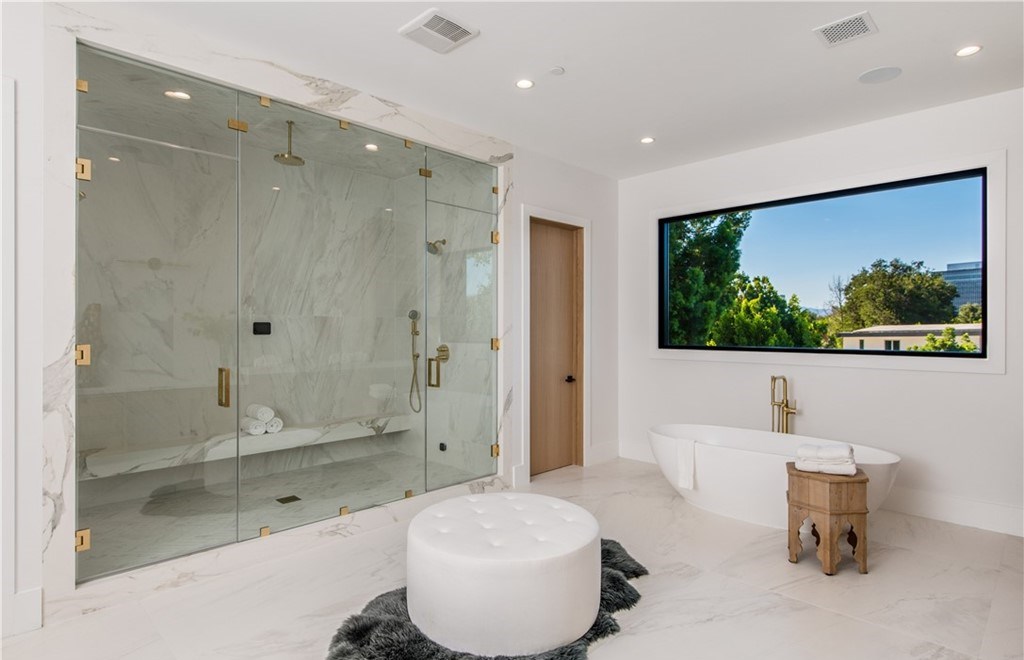 The Farmhouse in Encino, Exquisite new construction gated estate in the coveted enclave of Royal Oaks neighborhood with the sprawling grounds featuring a sparkling pool & spa, sports court, spacious elevated patio, grass area. This home located at 15825 Woodvale Rd, Encino, California