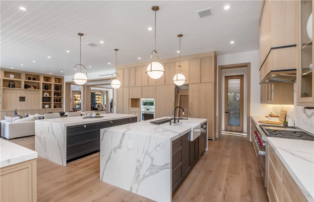 The Farmhouse in Encino, Exquisite new construction gated estate in the coveted enclave of Royal Oaks neighborhood with the sprawling grounds featuring a sparkling pool & spa, sports court, spacious elevated patio, grass area. This home located at 15825 Woodvale Rd, Encino, California