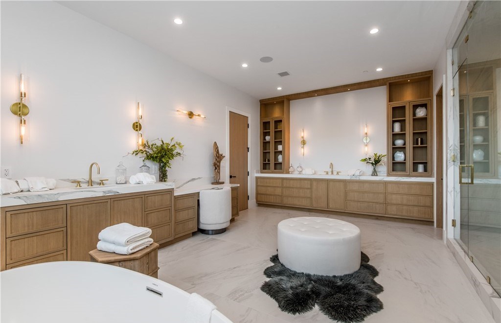 The Farmhouse in Encino, Exquisite new construction gated estate in the coveted enclave of Royal Oaks neighborhood with the sprawling grounds featuring a sparkling pool & spa, sports court, spacious elevated patio, grass area. This home located at 15825 Woodvale Rd, Encino, California