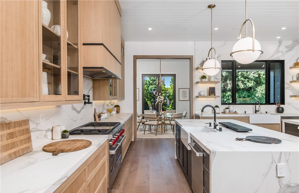 The Farmhouse in Encino, Exquisite new construction gated estate in the coveted enclave of Royal Oaks neighborhood with the sprawling grounds featuring a sparkling pool & spa, sports court, spacious elevated patio, grass area. This home located at 15825 Woodvale Rd, Encino, California