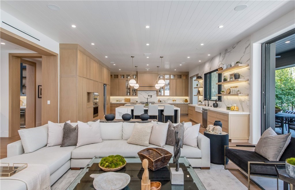 The Farmhouse in Encino, Exquisite new construction gated estate in the coveted enclave of Royal Oaks neighborhood with the sprawling grounds featuring a sparkling pool & spa, sports court, spacious elevated patio, grass area. This home located at 15825 Woodvale Rd, Encino, California