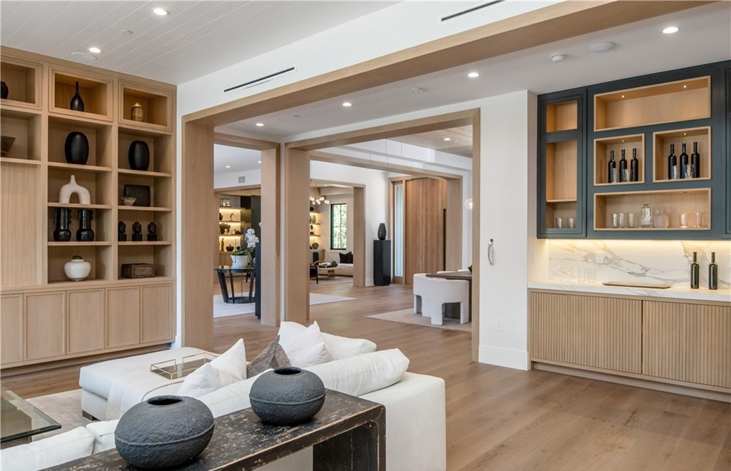 The Farmhouse in Encino, Exquisite new construction gated estate in the coveted enclave of Royal Oaks neighborhood with the sprawling grounds featuring a sparkling pool & spa, sports court, spacious elevated patio, grass area. This home located at 15825 Woodvale Rd, Encino, California