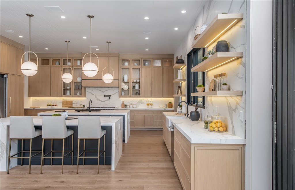 The Farmhouse in Encino, Exquisite new construction gated estate in the coveted enclave of Royal Oaks neighborhood with the sprawling grounds featuring a sparkling pool & spa, sports court, spacious elevated patio, grass area. This home located at 15825 Woodvale Rd, Encino, California