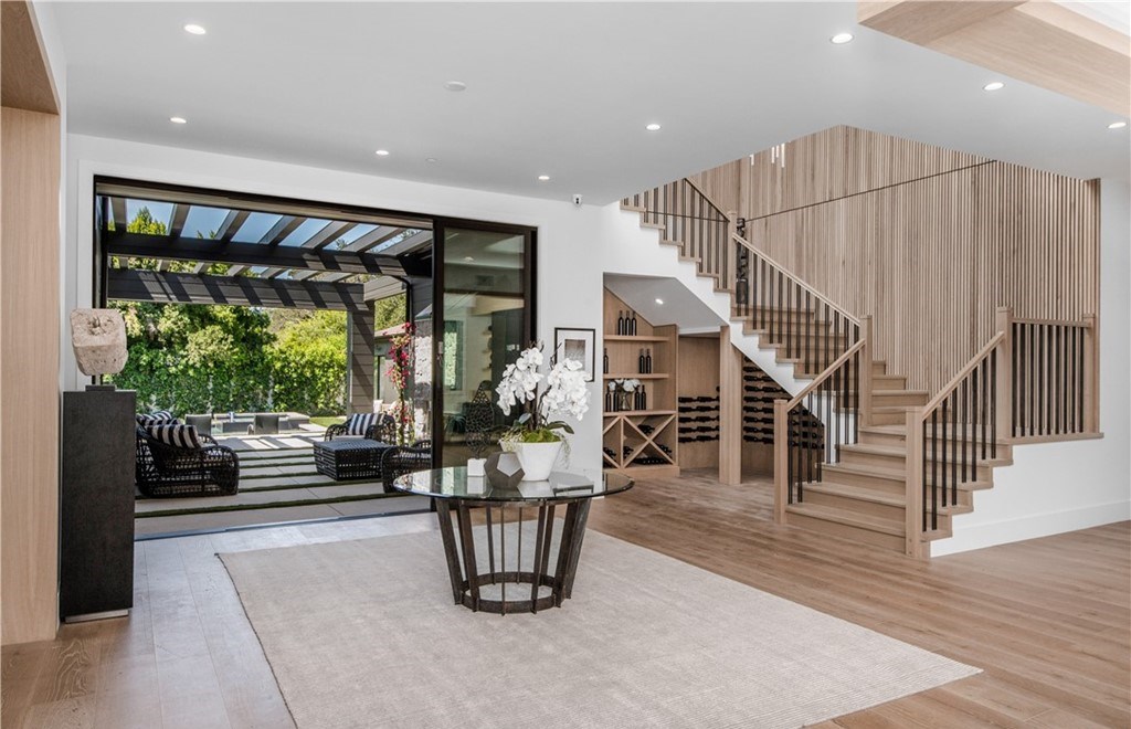 The Farmhouse in Encino, Exquisite new construction gated estate in the coveted enclave of Royal Oaks neighborhood with the sprawling grounds featuring a sparkling pool & spa, sports court, spacious elevated patio, grass area. This home located at 15825 Woodvale Rd, Encino, California