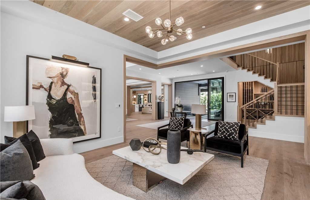 The Farmhouse in Encino, Exquisite new construction gated estate in the coveted enclave of Royal Oaks neighborhood with the sprawling grounds featuring a sparkling pool & spa, sports court, spacious elevated patio, grass area. This home located at 15825 Woodvale Rd, Encino, California