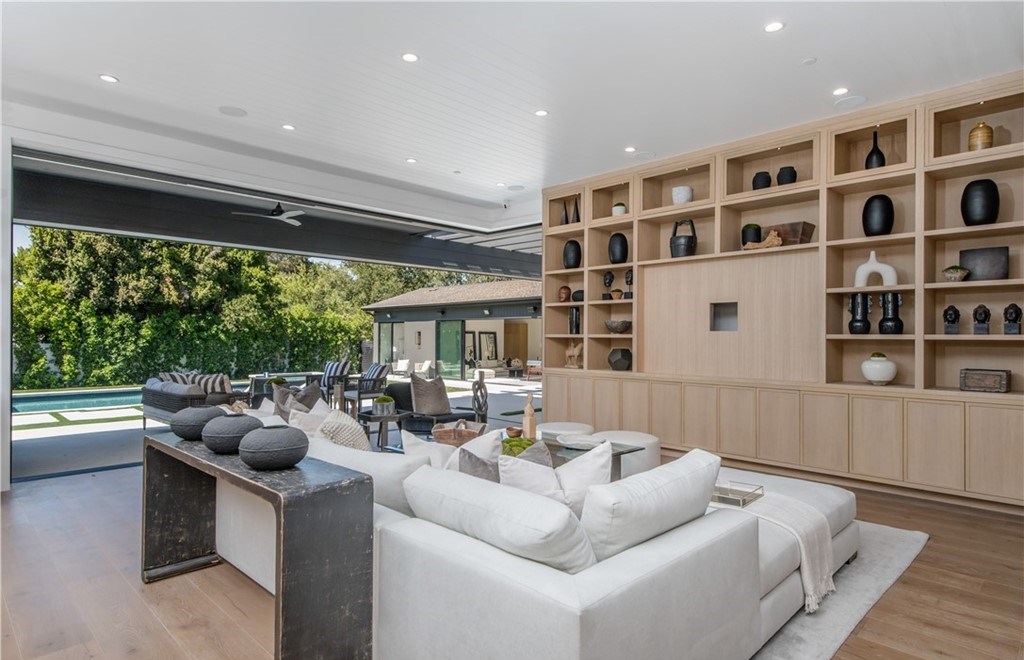 The Farmhouse in Encino, Exquisite new construction gated estate in the coveted enclave of Royal Oaks neighborhood with the sprawling grounds featuring a sparkling pool & spa, sports court, spacious elevated patio, grass area. This home located at 15825 Woodvale Rd, Encino, California