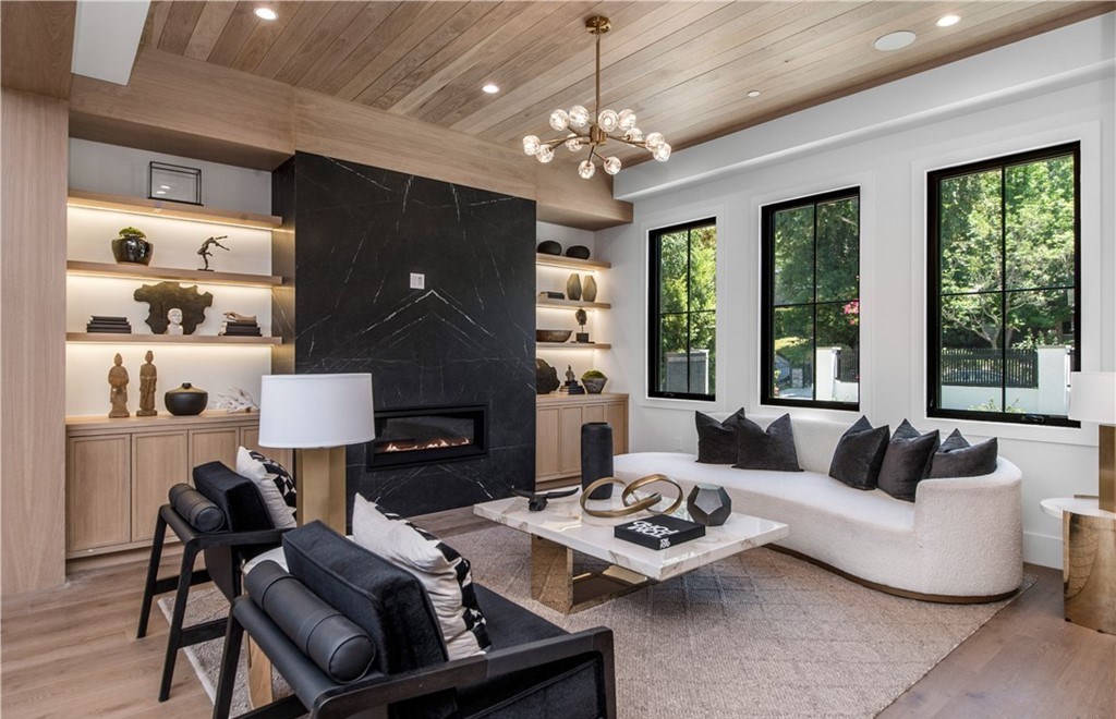 The Farmhouse in Encino, Exquisite new construction gated estate in the coveted enclave of Royal Oaks neighborhood with the sprawling grounds featuring a sparkling pool & spa, sports court, spacious elevated patio, grass area. This home located at 15825 Woodvale Rd, Encino, California