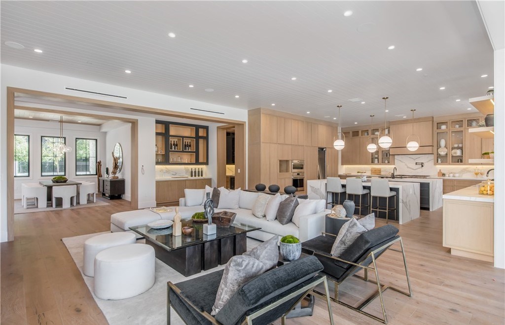 The Farmhouse in Encino, Exquisite new construction gated estate in the coveted enclave of Royal Oaks neighborhood with the sprawling grounds featuring a sparkling pool & spa, sports court, spacious elevated patio, grass area. This home located at 15825 Woodvale Rd, Encino, California