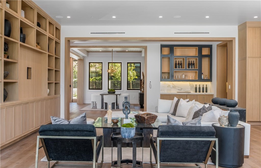 The Farmhouse in Encino, Exquisite new construction gated estate in the coveted enclave of Royal Oaks neighborhood with the sprawling grounds featuring a sparkling pool & spa, sports court, spacious elevated patio, grass area. This home located at 15825 Woodvale Rd, Encino, California