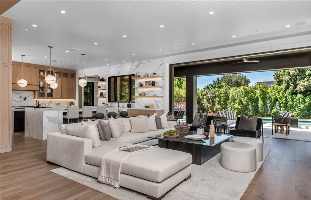 The Farmhouse in Encino, Exquisite new construction gated estate in the coveted enclave of Royal Oaks neighborhood with the sprawling grounds featuring a sparkling pool & spa, sports court, spacious elevated patio, grass area. This home located at 15825 Woodvale Rd, Encino, California