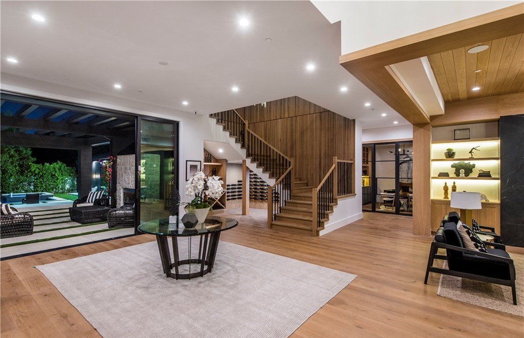 The Farmhouse in Encino, Exquisite new construction gated estate in the coveted enclave of Royal Oaks neighborhood with the sprawling grounds featuring a sparkling pool & spa, sports court, spacious elevated patio, grass area. This home located at 15825 Woodvale Rd, Encino, California