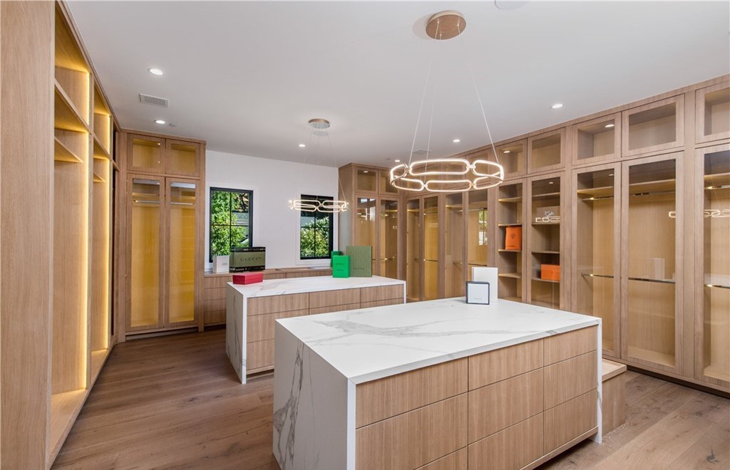 The Farmhouse in Encino, Exquisite new construction gated estate in the coveted enclave of Royal Oaks neighborhood with the sprawling grounds featuring a sparkling pool & spa, sports court, spacious elevated patio, grass area. This home located at 15825 Woodvale Rd, Encino, California