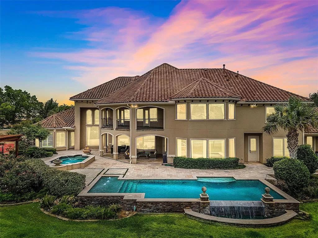 The Estate in Richmond, a private oasis nestled within The Retreat at Sovereign Shores offers resort style with a lavish swimming pool, tennis court, multiple outdoor patios is now available for sale. This home located at 12 Retreat Blvd, Richmond, Texas 