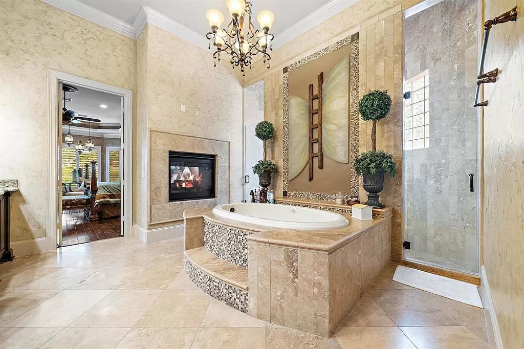 The Estate in Richmond, a private oasis nestled within The Retreat at Sovereign Shores offers resort style with a lavish swimming pool, tennis court, multiple outdoor patios is now available for sale. This home located at 12 Retreat Blvd, Richmond, Texas 