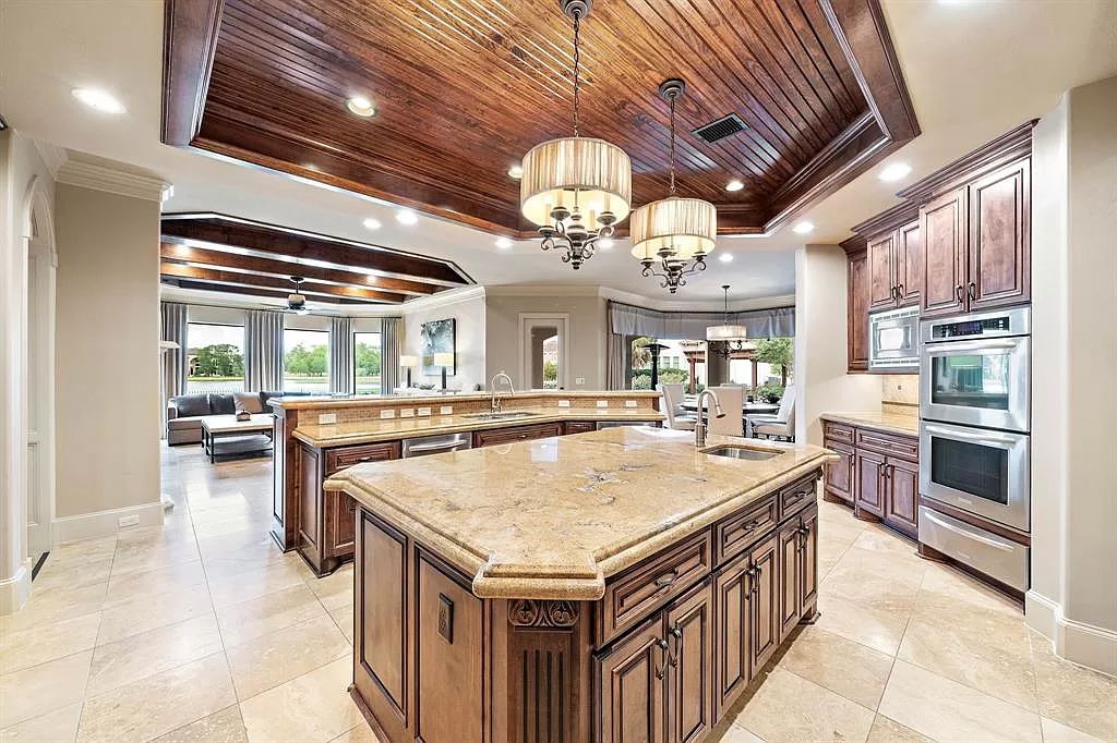 The Estate in Richmond, a private oasis nestled within The Retreat at Sovereign Shores offers resort style with a lavish swimming pool, tennis court, multiple outdoor patios is now available for sale. This home located at 12 Retreat Blvd, Richmond, Texas 