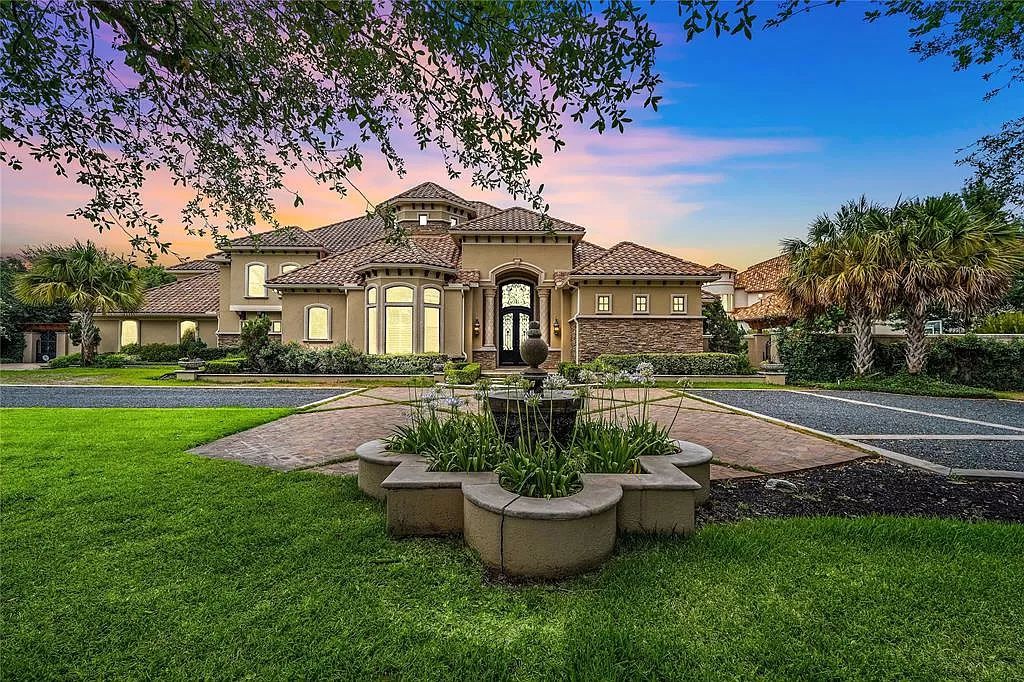 The Estate in Richmond, a private oasis nestled within The Retreat at Sovereign Shores offers resort style with a lavish swimming pool, tennis court, multiple outdoor patios is now available for sale. This home located at 12 Retreat Blvd, Richmond, Texas 