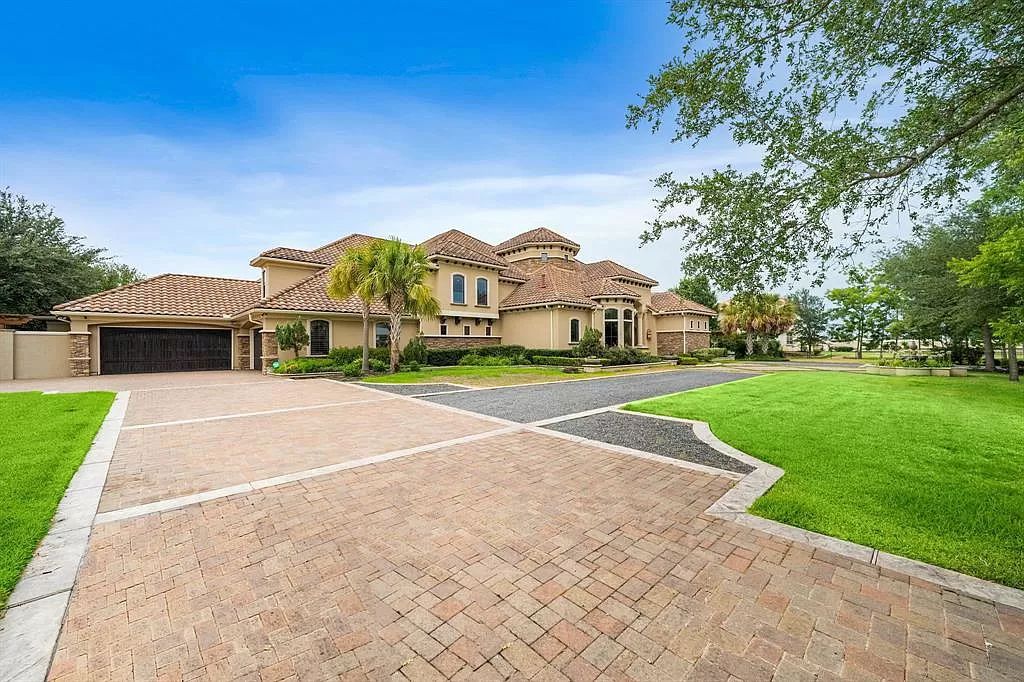The Estate in Richmond, a private oasis nestled within The Retreat at Sovereign Shores offers resort style with a lavish swimming pool, tennis court, multiple outdoor patios is now available for sale. This home located at 12 Retreat Blvd, Richmond, Texas 