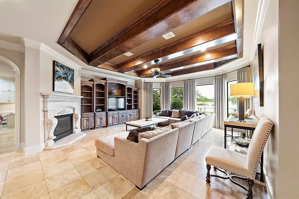 The Estate in Richmond, a private oasis nestled within The Retreat at Sovereign Shores offers resort style with a lavish swimming pool, tennis court, multiple outdoor patios is now available for sale. This home located at 12 Retreat Blvd, Richmond, Texas 