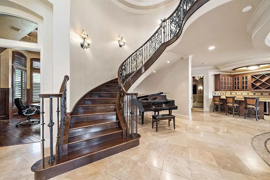 The Estate in Richmond, a private oasis nestled within The Retreat at Sovereign Shores offers resort style with a lavish swimming pool, tennis court, multiple outdoor patios is now available for sale. This home located at 12 Retreat Blvd, Richmond, Texas 