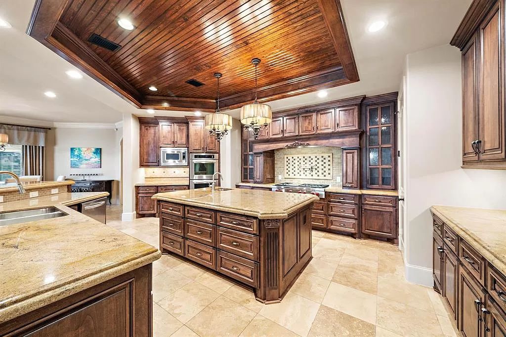 The Estate in Richmond, a private oasis nestled within The Retreat at Sovereign Shores offers resort style with a lavish swimming pool, tennis court, multiple outdoor patios is now available for sale. This home located at 12 Retreat Blvd, Richmond, Texas 