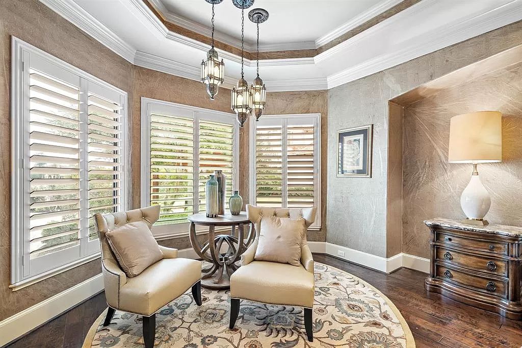 The Estate in Richmond, a private oasis nestled within The Retreat at Sovereign Shores offers resort style with a lavish swimming pool, tennis court, multiple outdoor patios is now available for sale. This home located at 12 Retreat Blvd, Richmond, Texas 