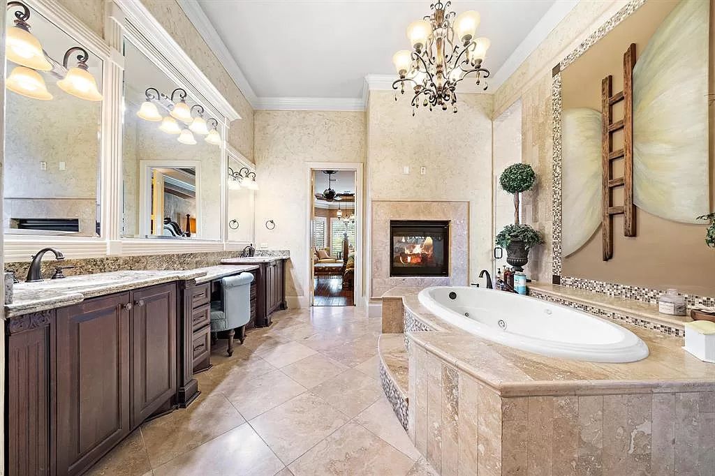 The Estate in Richmond, a private oasis nestled within The Retreat at Sovereign Shores offers resort style with a lavish swimming pool, tennis court, multiple outdoor patios is now available for sale. This home located at 12 Retreat Blvd, Richmond, Texas 