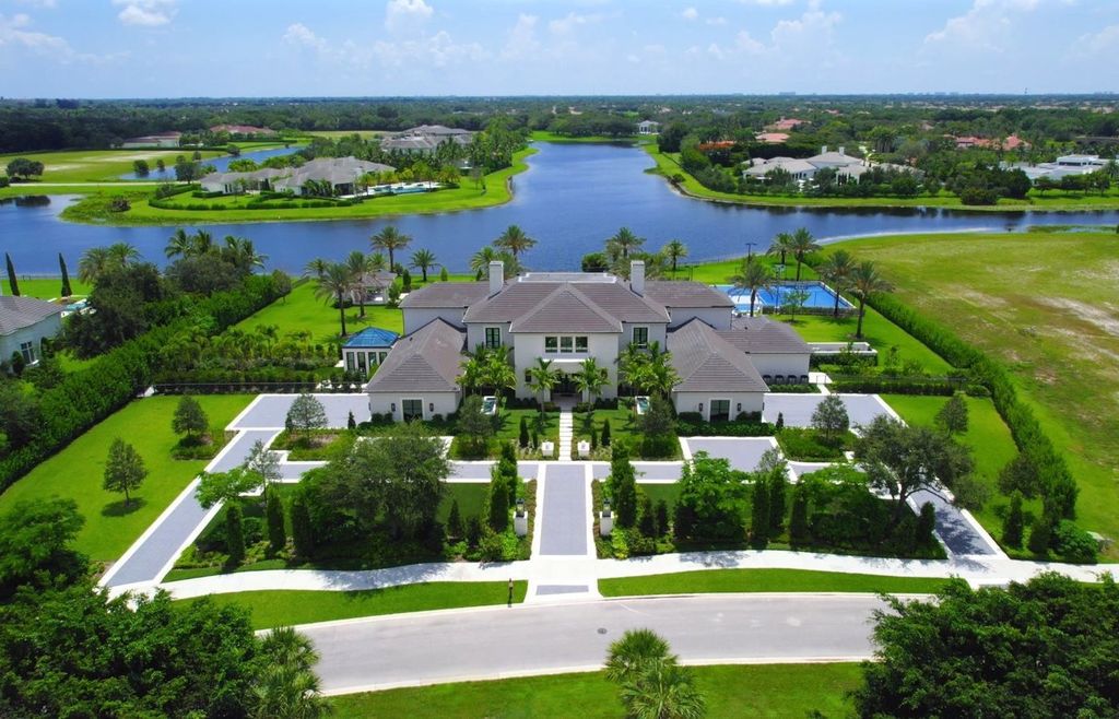 The Estate in Delray Beach, an extraordinary prestigious fully furnished custom home set prime lakefront site, open and mesmerizing T-shaped views. This home located at 16071 Quiet Vista Cir, Delray Beach, Florida.