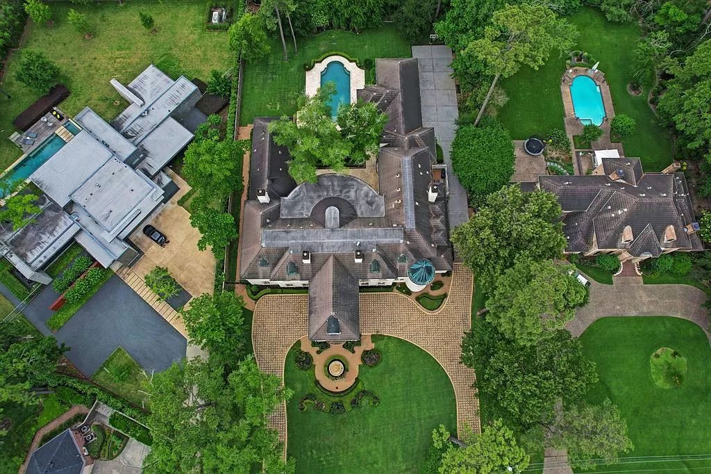 The Masterpiece in Houston, a memorial estate showcases cohesive French design elements blending rustic textures and bold materials. This home located at 705 Kuhlman Rd, Houston, Texas.