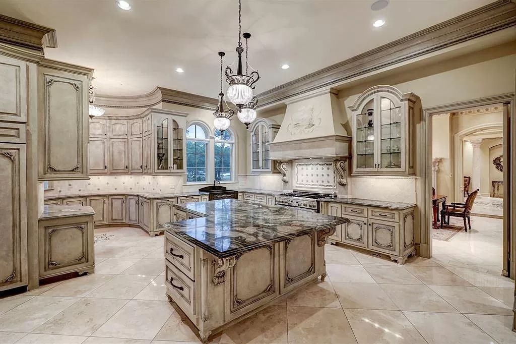 The Masterpiece in Houston, a memorial estate showcases cohesive French design elements blending rustic textures and bold materials. This home located at 705 Kuhlman Rd, Houston, Texas.