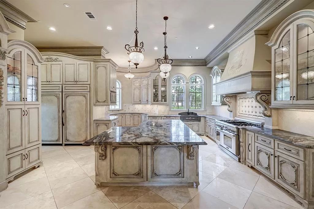 The Masterpiece in Houston, a memorial estate showcases cohesive French design elements blending rustic textures and bold materials. This home located at 705 Kuhlman Rd, Houston, Texas.