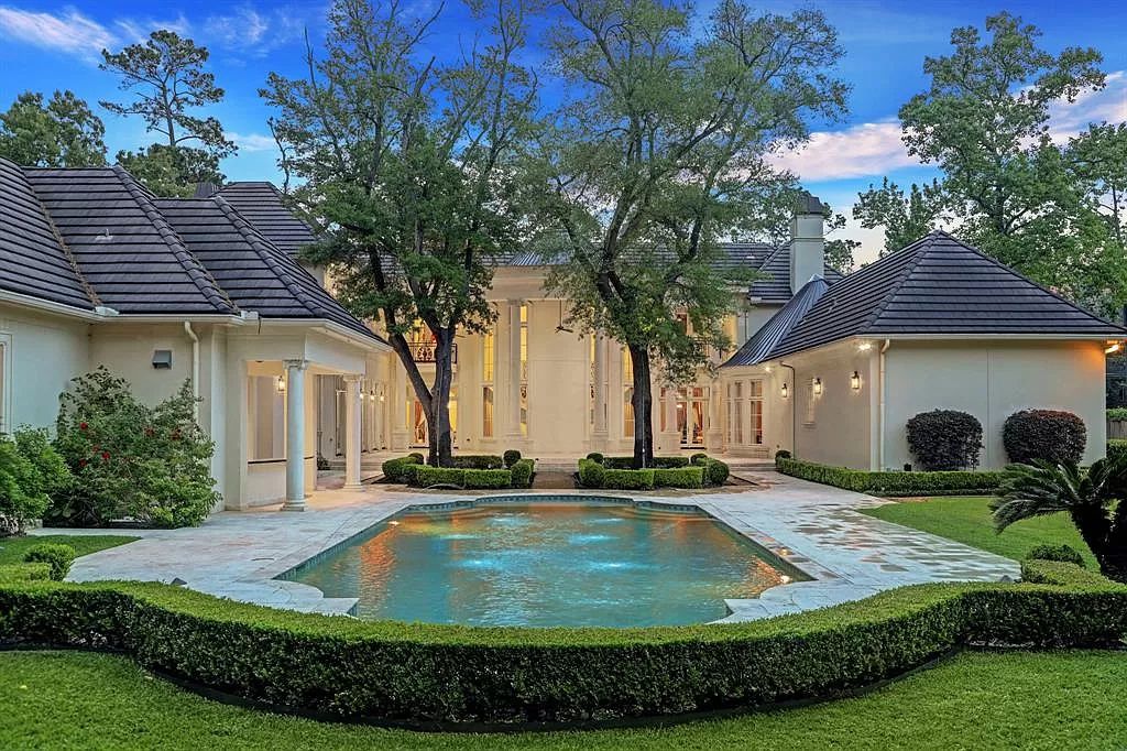 The Masterpiece in Houston, a memorial estate showcases cohesive French design elements blending rustic textures and bold materials. This home located at 705 Kuhlman Rd, Houston, Texas.
