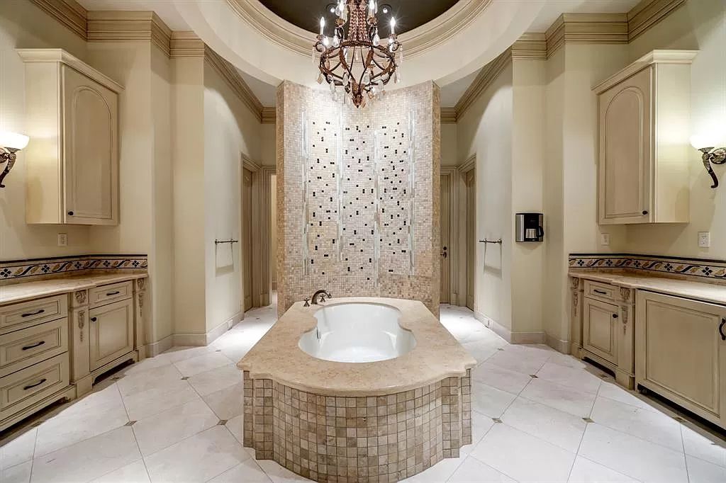 The Masterpiece in Houston, a memorial estate showcases cohesive French design elements blending rustic textures and bold materials. This home located at 705 Kuhlman Rd, Houston, Texas.