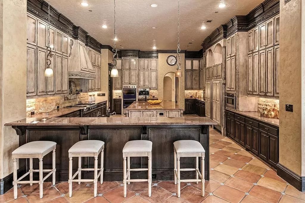 The Estate in Southlake, a castle-like residence blends old world appeal with a modern layout featuring breathtaking ceiling treatments and hand-carved moldings is now available for sale. This home located at 3716 N White Chapel Blvd, Southlake, Texas