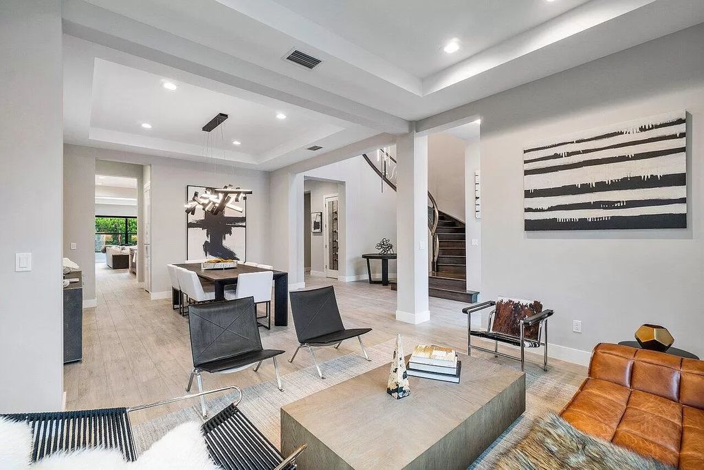 The Home in Boca Raton, a contemporary estate offers notable features include concrete construction, impact glass, custom entry ''pivot'' door, wine storage, theater room  is now available for sale. This home located at 17558 Cadena Dr, Boca Raton, Florida