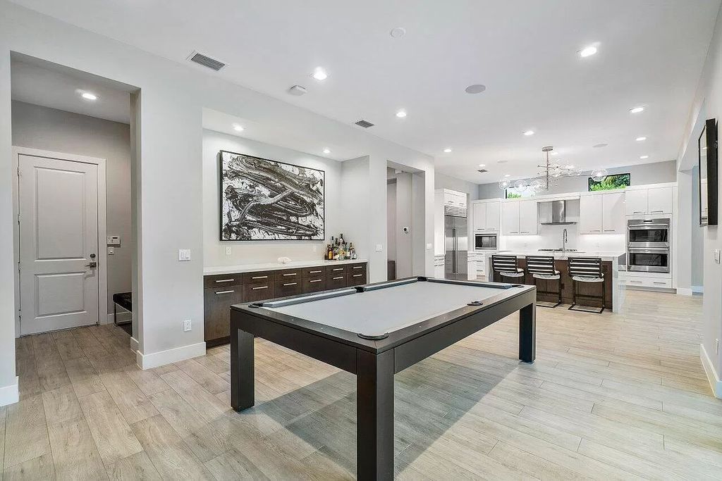 The Home in Boca Raton, a contemporary estate offers notable features include concrete construction, impact glass, custom entry ''pivot'' door, wine storage, theater room  is now available for sale. This home located at 17558 Cadena Dr, Boca Raton, Florida