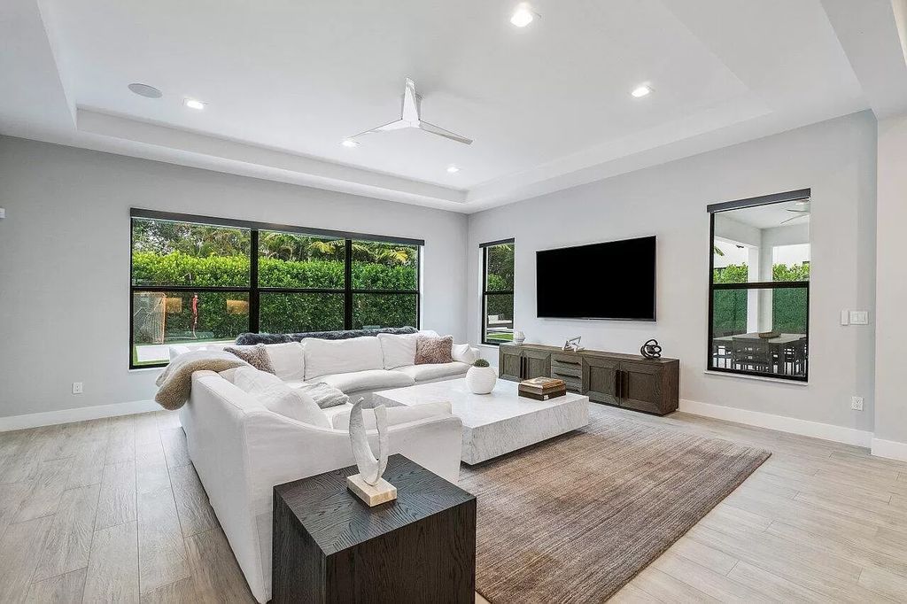 The Home in Boca Raton, a contemporary estate offers notable features include concrete construction, impact glass, custom entry ''pivot'' door, wine storage, theater room  is now available for sale. This home located at 17558 Cadena Dr, Boca Raton, Florida