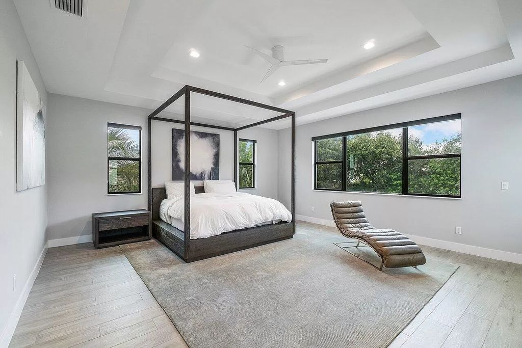 The Home in Boca Raton, a contemporary estate offers notable features include concrete construction, impact glass, custom entry ''pivot'' door, wine storage, theater room  is now available for sale. This home located at 17558 Cadena Dr, Boca Raton, Florida