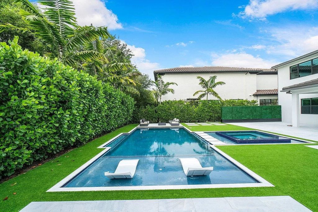 The Home in Boca Raton, a contemporary estate offers notable features include concrete construction, impact glass, custom entry ''pivot'' door, wine storage, theater room  is now available for sale. This home located at 17558 Cadena Dr, Boca Raton, Florida
