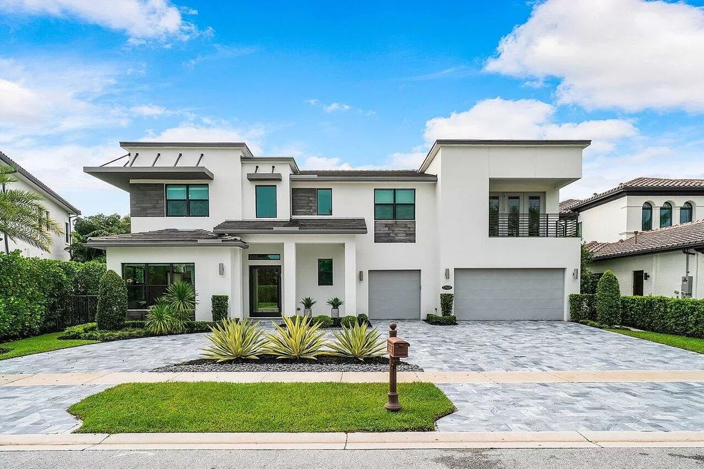 The Home in Boca Raton, a contemporary estate offers notable features include concrete construction, impact glass, custom entry ''pivot'' door, wine storage, theater room  is now available for sale. This home located at 17558 Cadena Dr, Boca Raton, Florida