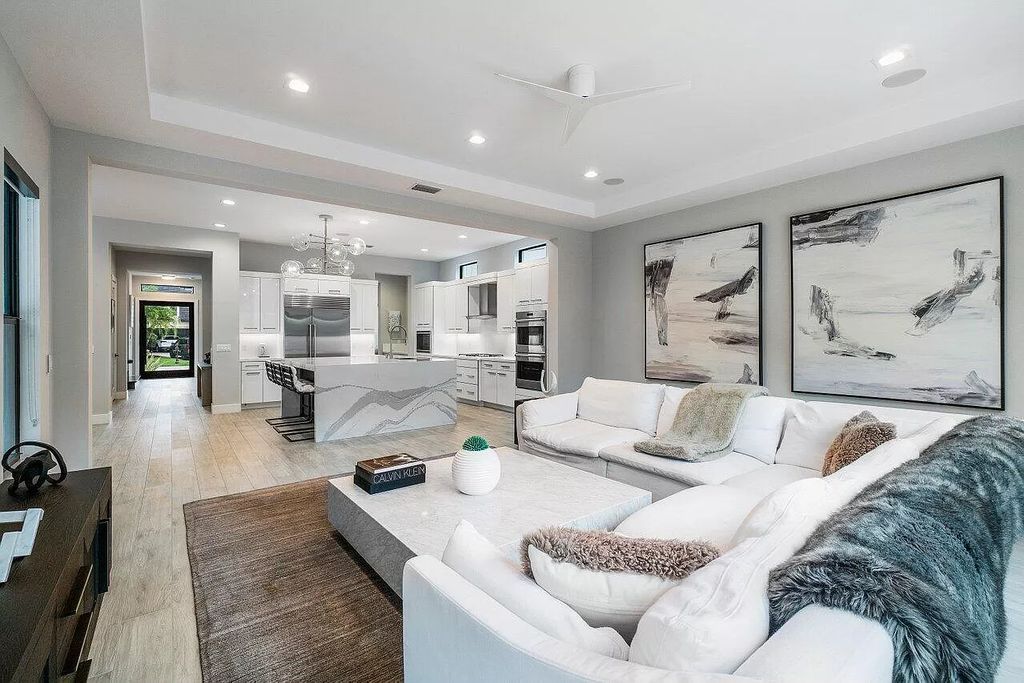 The Home in Boca Raton, a contemporary estate offers notable features include concrete construction, impact glass, custom entry ''pivot'' door, wine storage, theater room  is now available for sale. This home located at 17558 Cadena Dr, Boca Raton, Florida