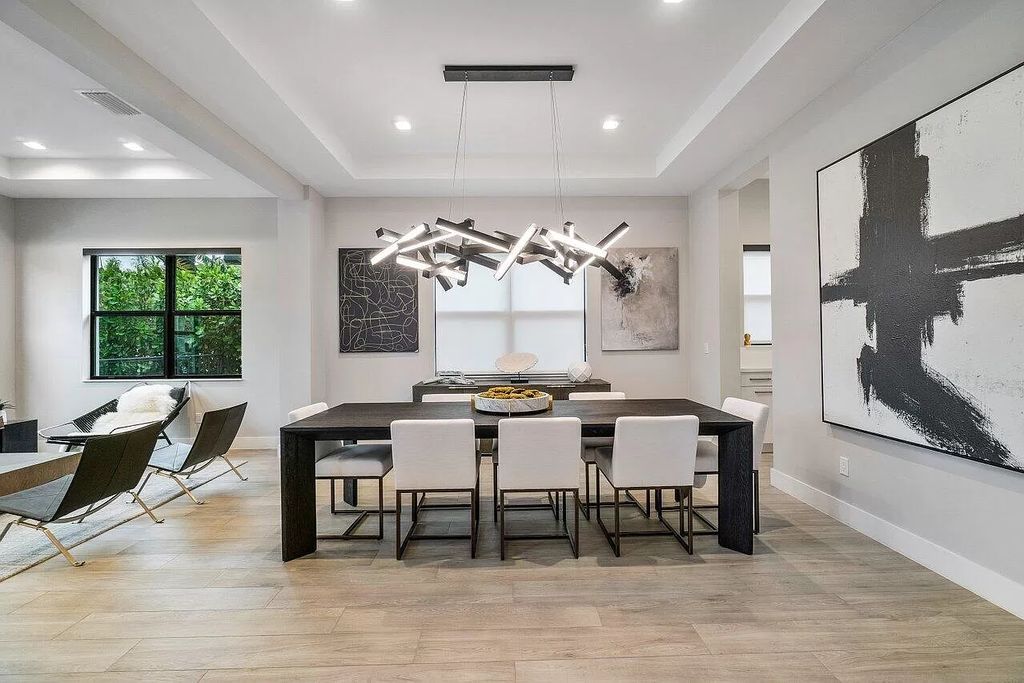 The Home in Boca Raton, a contemporary estate offers notable features include concrete construction, impact glass, custom entry ''pivot'' door, wine storage, theater room  is now available for sale. This home located at 17558 Cadena Dr, Boca Raton, Florida