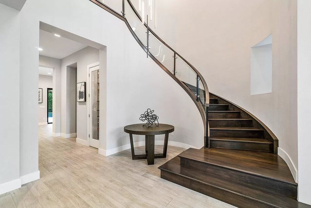 The Home in Boca Raton, a contemporary estate offers notable features include concrete construction, impact glass, custom entry ''pivot'' door, wine storage, theater room  is now available for sale. This home located at 17558 Cadena Dr, Boca Raton, Florida