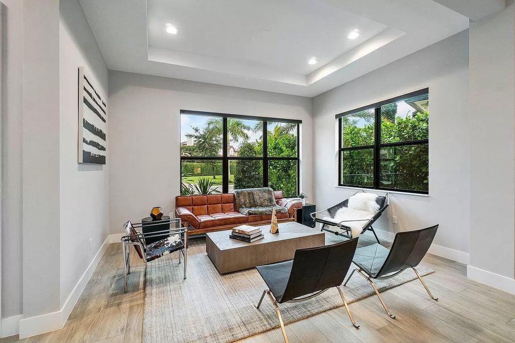 The Home in Boca Raton, a contemporary estate offers notable features include concrete construction, impact glass, custom entry ''pivot'' door, wine storage, theater room  is now available for sale. This home located at 17558 Cadena Dr, Boca Raton, Florida
