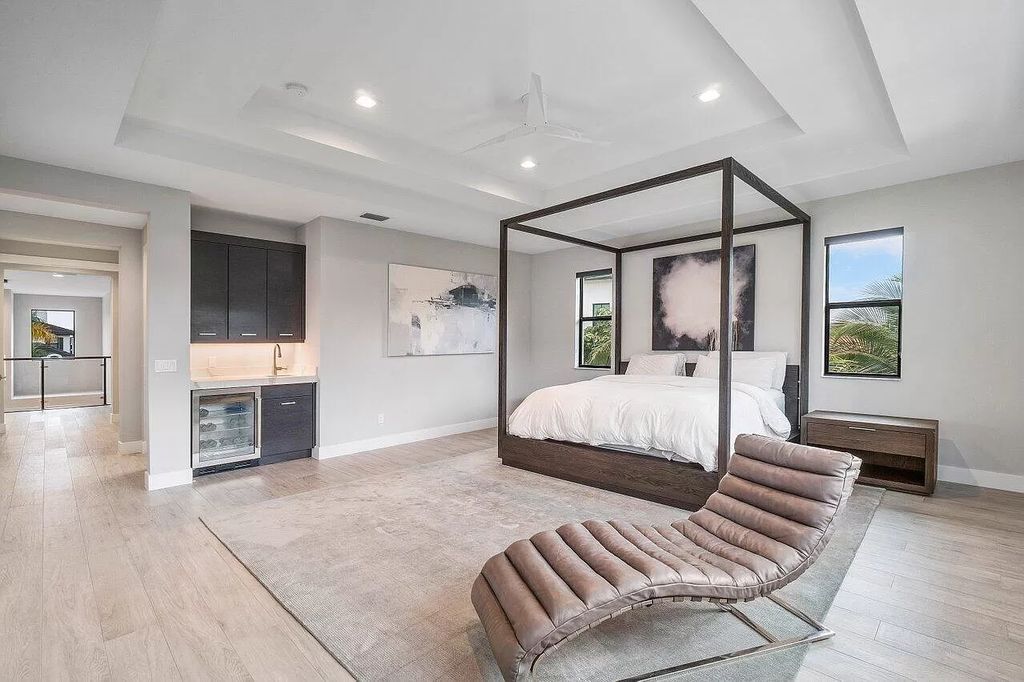 The Home in Boca Raton, a contemporary estate offers notable features include concrete construction, impact glass, custom entry ''pivot'' door, wine storage, theater room  is now available for sale. This home located at 17558 Cadena Dr, Boca Raton, Florida