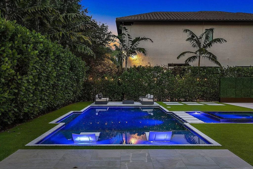 The Home in Boca Raton, a contemporary estate offers notable features include concrete construction, impact glass, custom entry ''pivot'' door, wine storage, theater room  is now available for sale. This home located at 17558 Cadena Dr, Boca Raton, Florida
