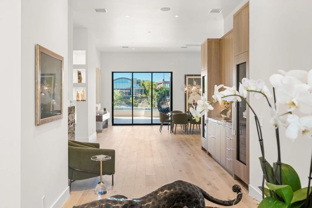 The Home in Las Vegas, a dramatic custom masterpiece with panoramic Red Rock Conservation views defines modern sophistication with sleek timeless finishes is now available for sale. This house located at 74 Meadowhawk Ln, Las Vegas, Nevada